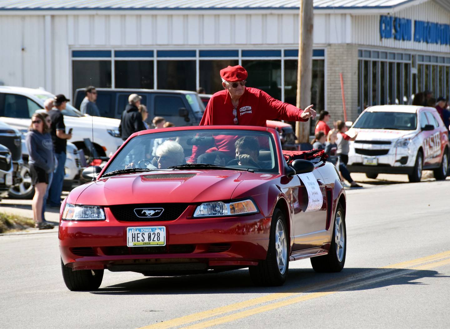 Creston Hall of Fame inductee Larry Goodrich waves to supporters during the homecoming parade Friday afternoon.