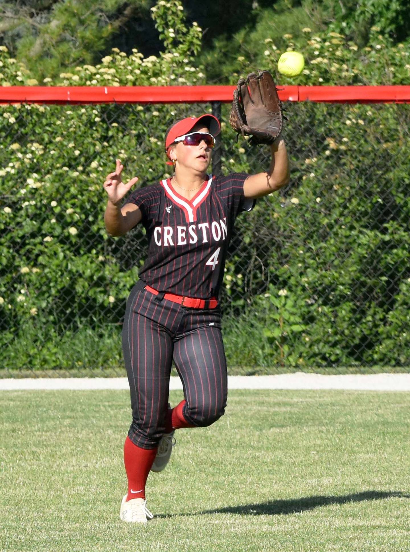 Centerfielder Jersey Foote catches a ball Monday in game one. She caught four on the night.