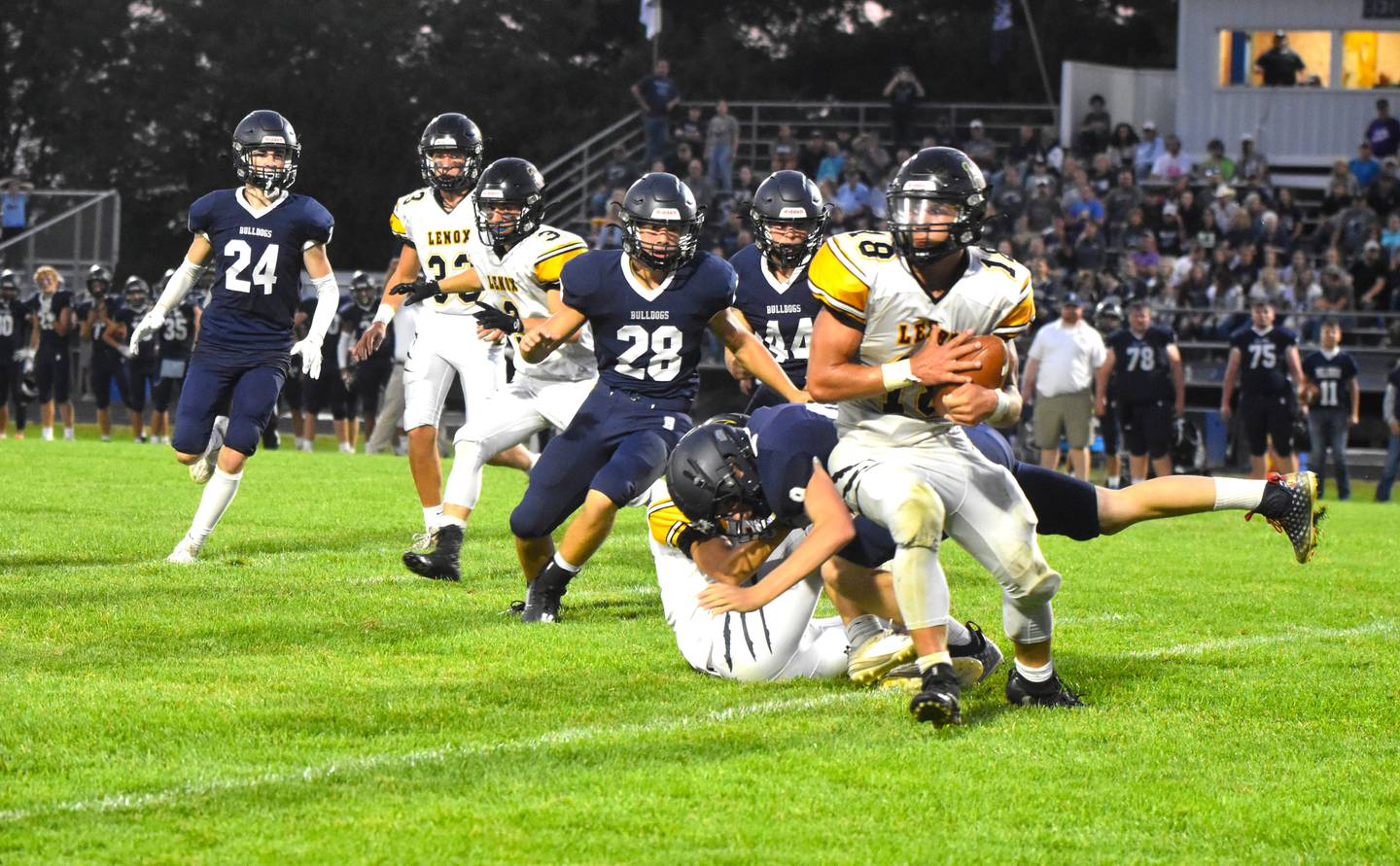 Jordan-Martin England puts a spin move on a Bedford defender as Laramie Stoaks blocks a defender, providing a hole for Martin-England to score on a 79-yard kickoff return.