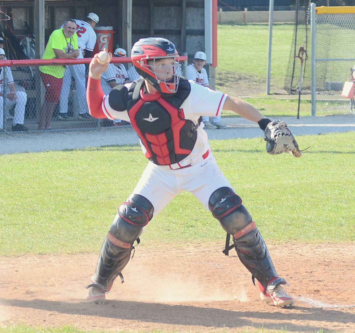 Creston catcher Milo Staver makes a pickoff throw to first base during Monday's doubleheader against Carroll Kuemper Catholic. Staver was 1-of-3 at the plate in the 9-2 victory.