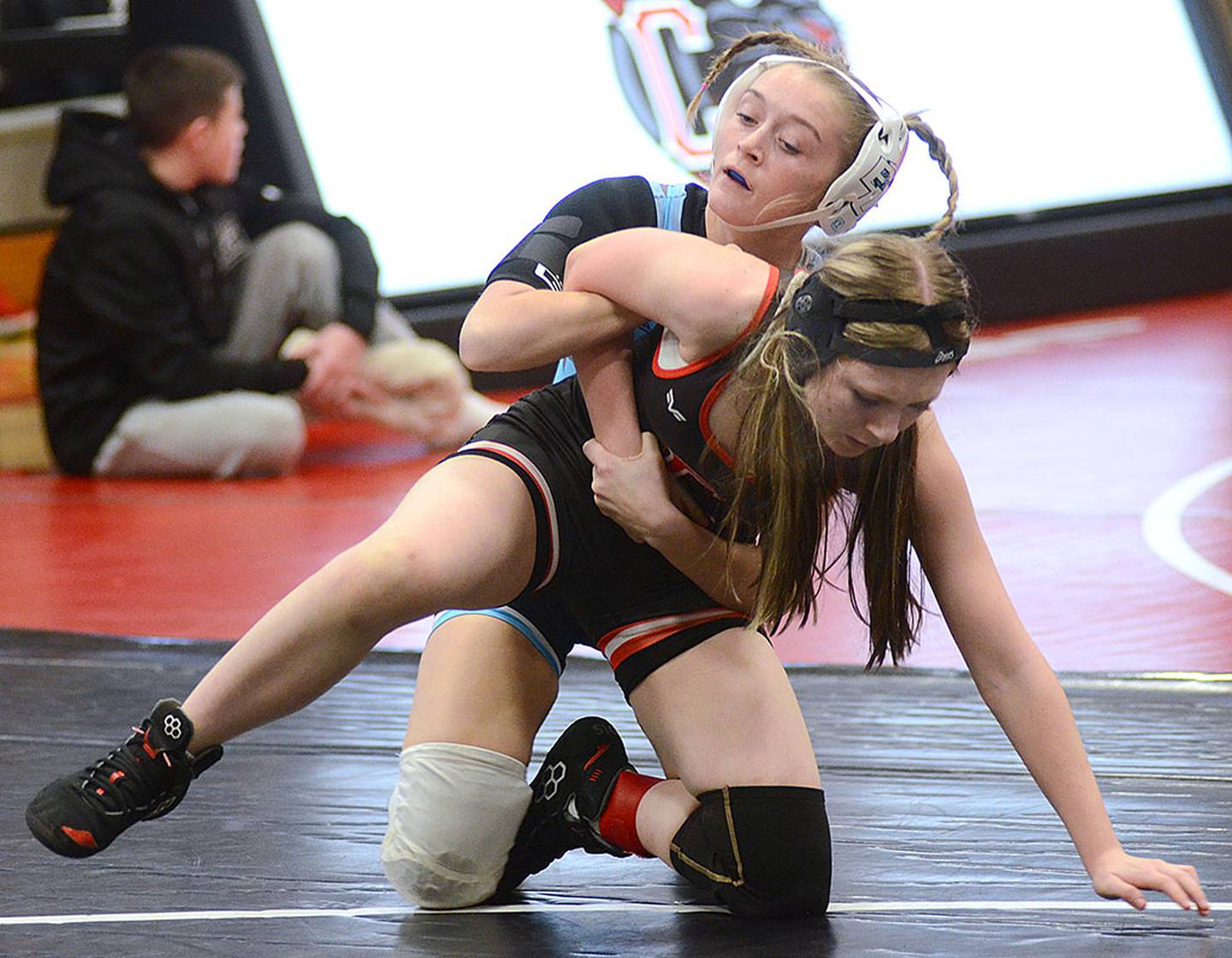 Quynn Foster of East Union works to maintain control of Creston's Kaylee Wells during Friday's Panther Invitational. Foster won the 105-pound weight class and Wells placed third.