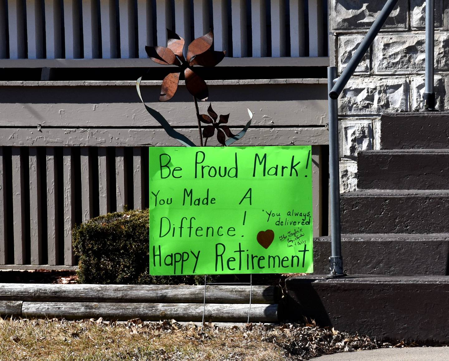 A sign wishing Mark Evans a happy retirement, proclaiming "you made a difference!"