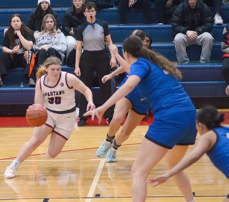 Southwestern's Maddie Richter drives into the lane against DMACC. At right is DMACC 6-4 sophomore center Missy Evezic of St. Albert. Richter had four points and five rebounds in the conference loss.