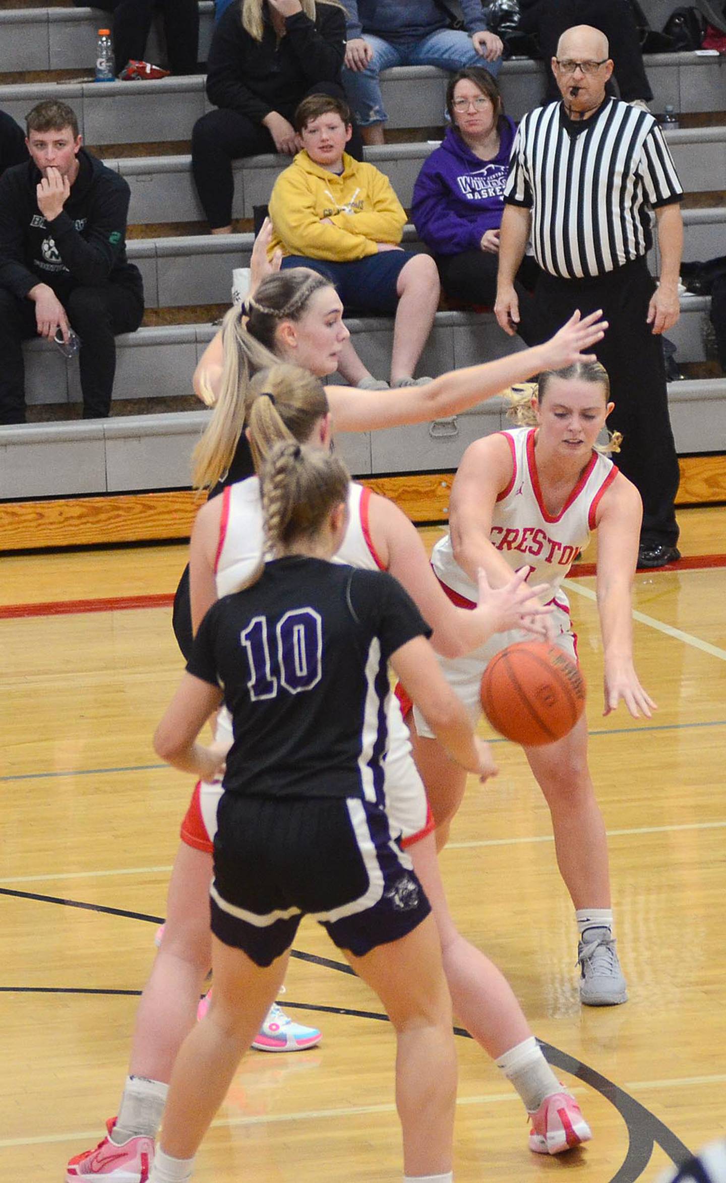 Ella Turner slips a bounce pass to Creston teammate Brynn Tussey at the high post during Monday's game against West Central Valley. Turner had six points, four steals, four rebounds and three blocked shots in the 46-43 win.