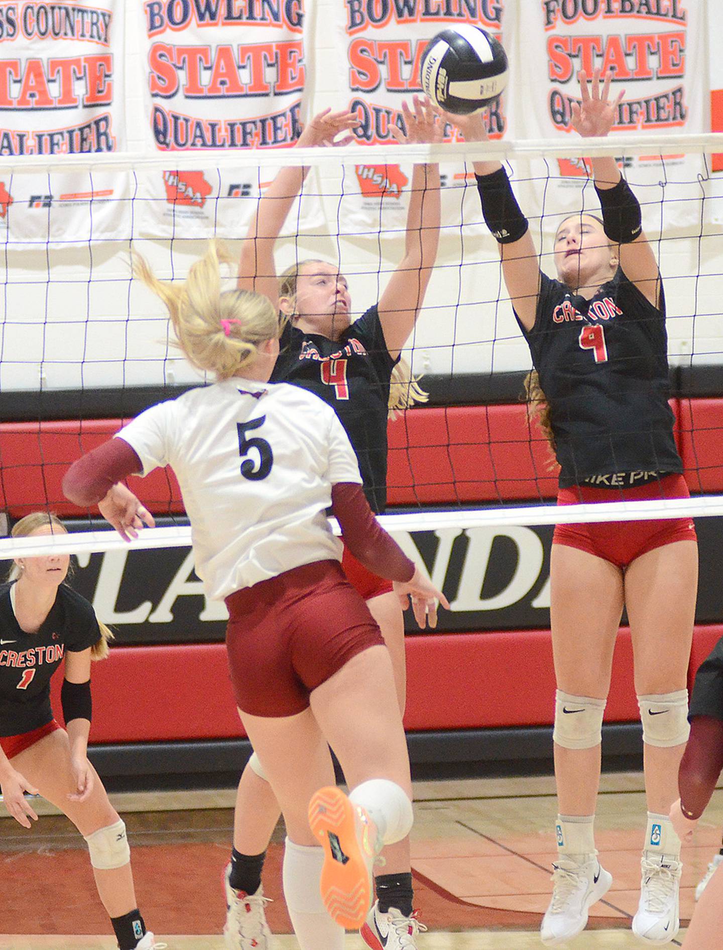 The Creston duo of Ella Turner (left) and Hope Henderson (9) block against Clarinda outside hitter Addison Wagoner (5). Wagoner had a match-high 19 kills.