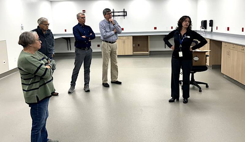 Greater Regional Health Board members Sherry McKie, Jack Davis, Kent Stults, Tom Lesan and Chief Quality Officer Kim Wheeler tour the expanded lab Monday still under construction. It is scheduled to be finished this spring.