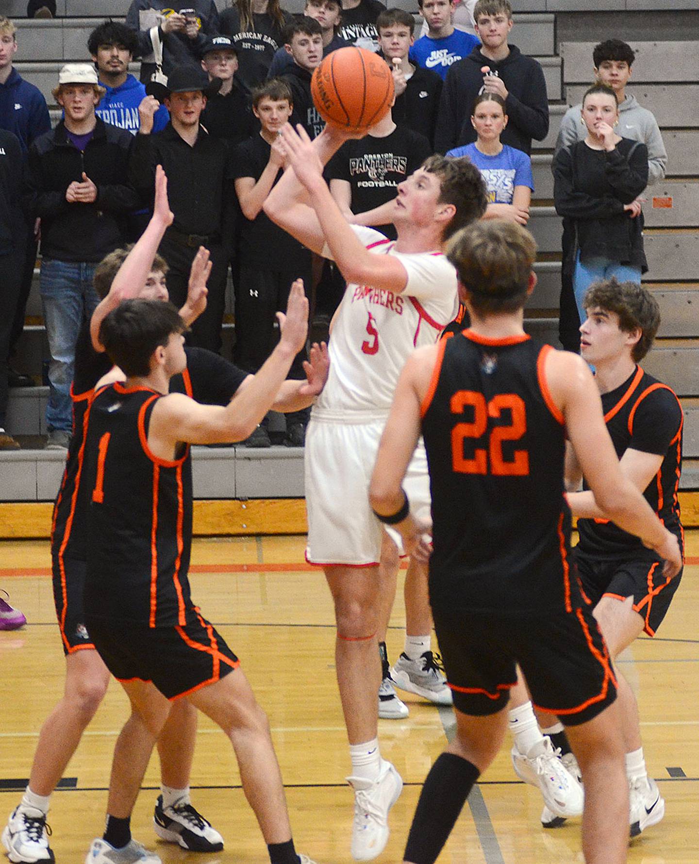 CT Stalker of Creston shoots in a crowd of Red Oak defenders during Monday's game. Stalker scored four points in the 45-40 loss.