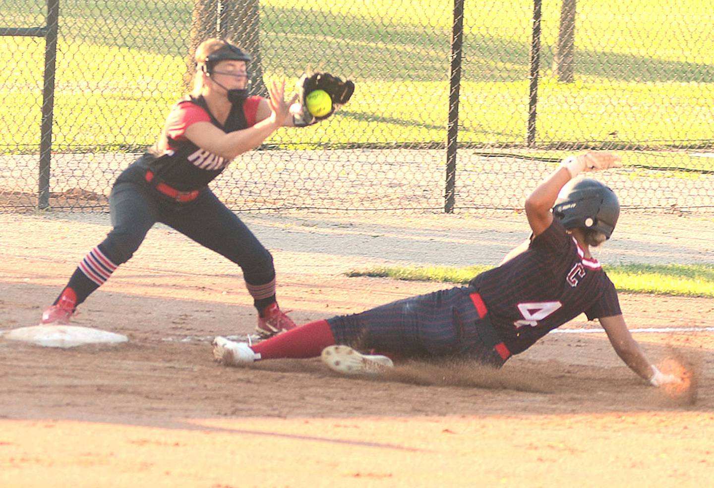 Jersey Foote (4) slides into third base with a triple that drove in a run during Creston's 14-1 win over Greene County. Foote finished with two hits and two RBIs.