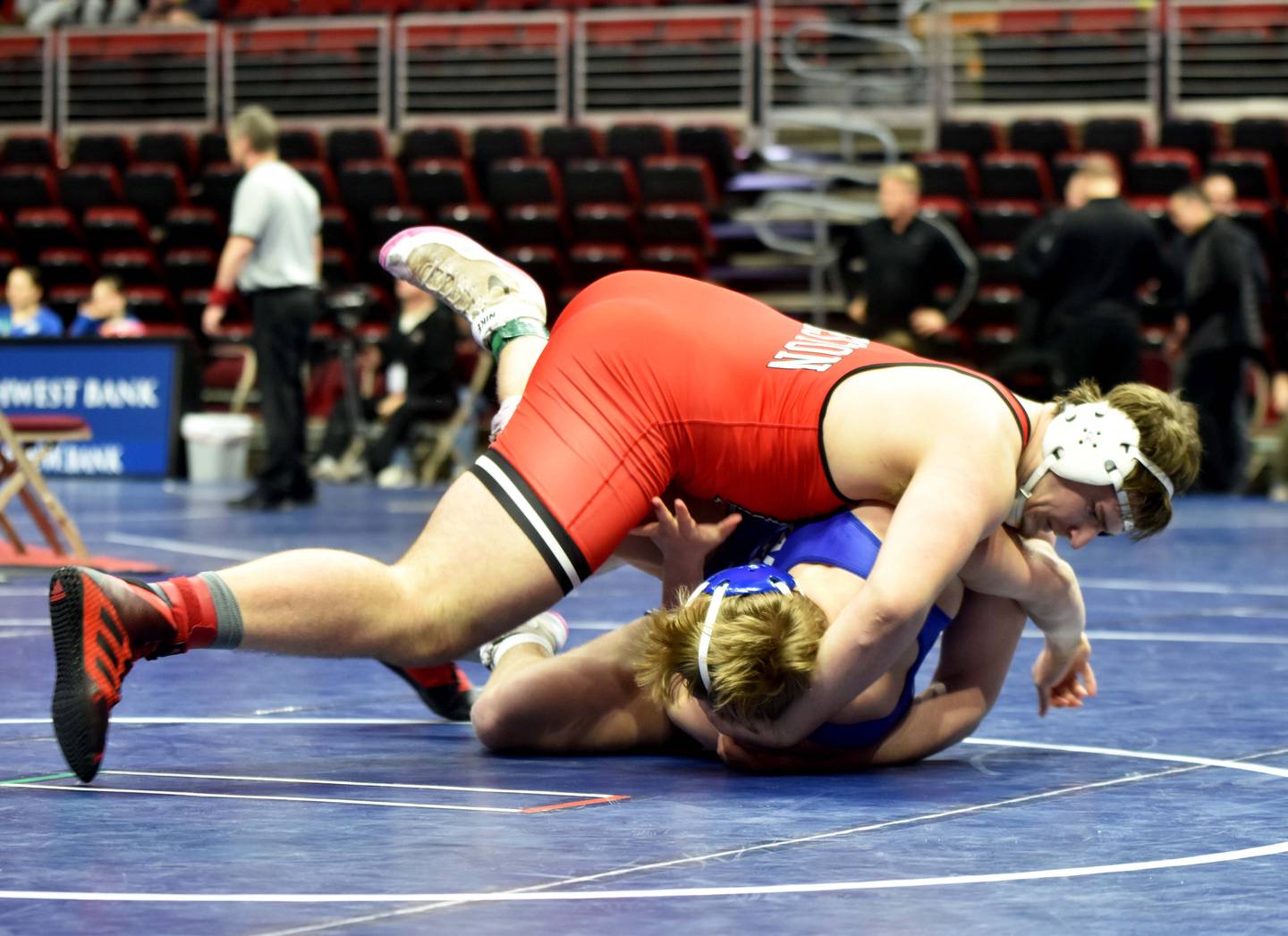 Senior heavyweight Max Chapman rolls Michael Bormann in round two of the state wrestling tournament Wednesday in Des Moines. Chapman won the bout with a 26-second pin to advance to the quarterfinals Thursday