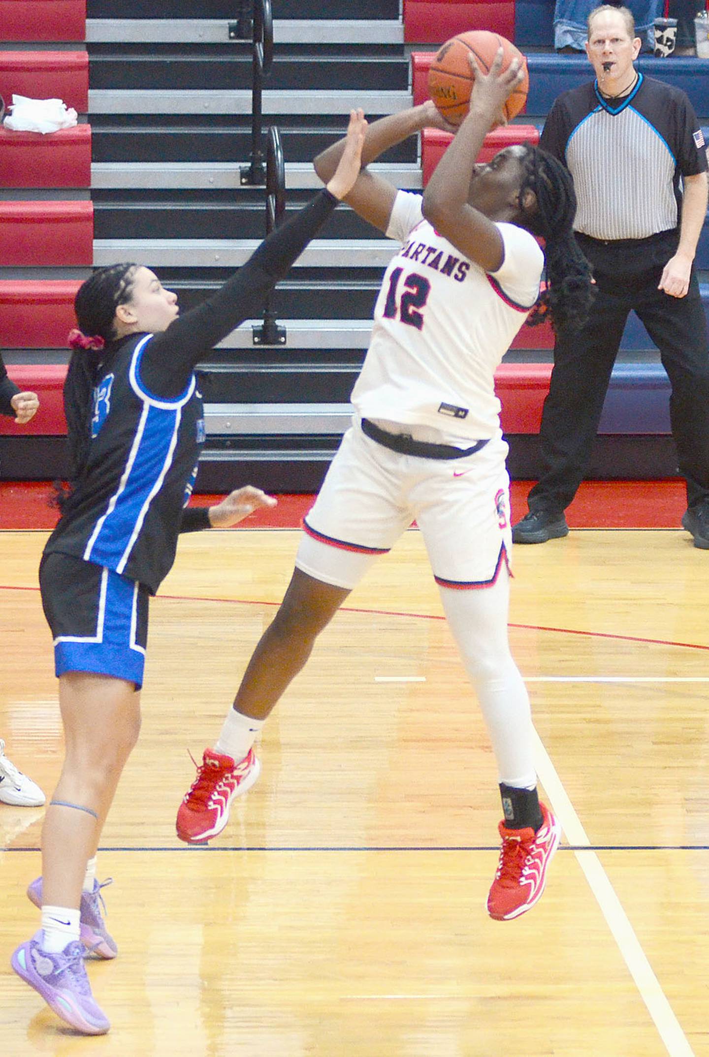 Southwestern's Gabby Dwanyen releases a shot in the lane against top-ranked Kirkwood Saturday. Dwanyen finished with a team-high 10 points and six rebounds.