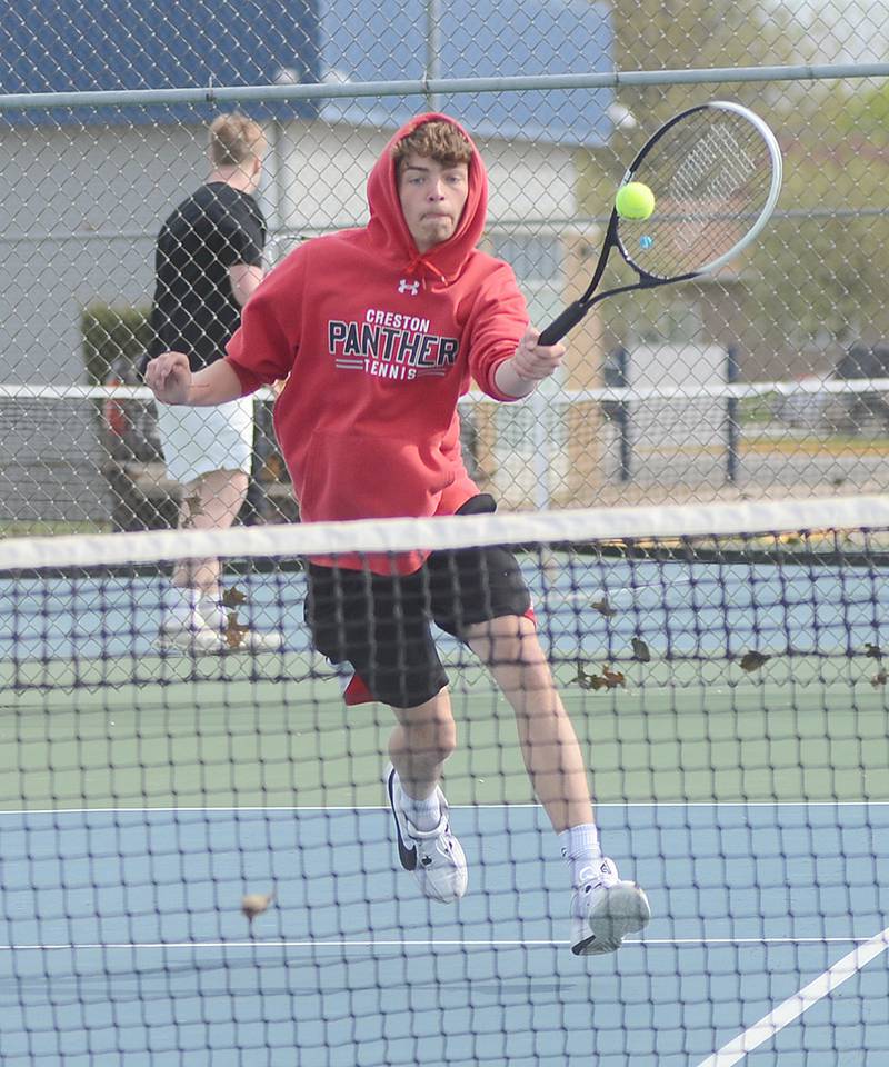 Creston's Damion Meyer hits a volley at the net during his 8-2 singles victory against Clarinda Monday. Meyer also teamed with Ben Hill for an 8-3 win at No. 2 doubles.