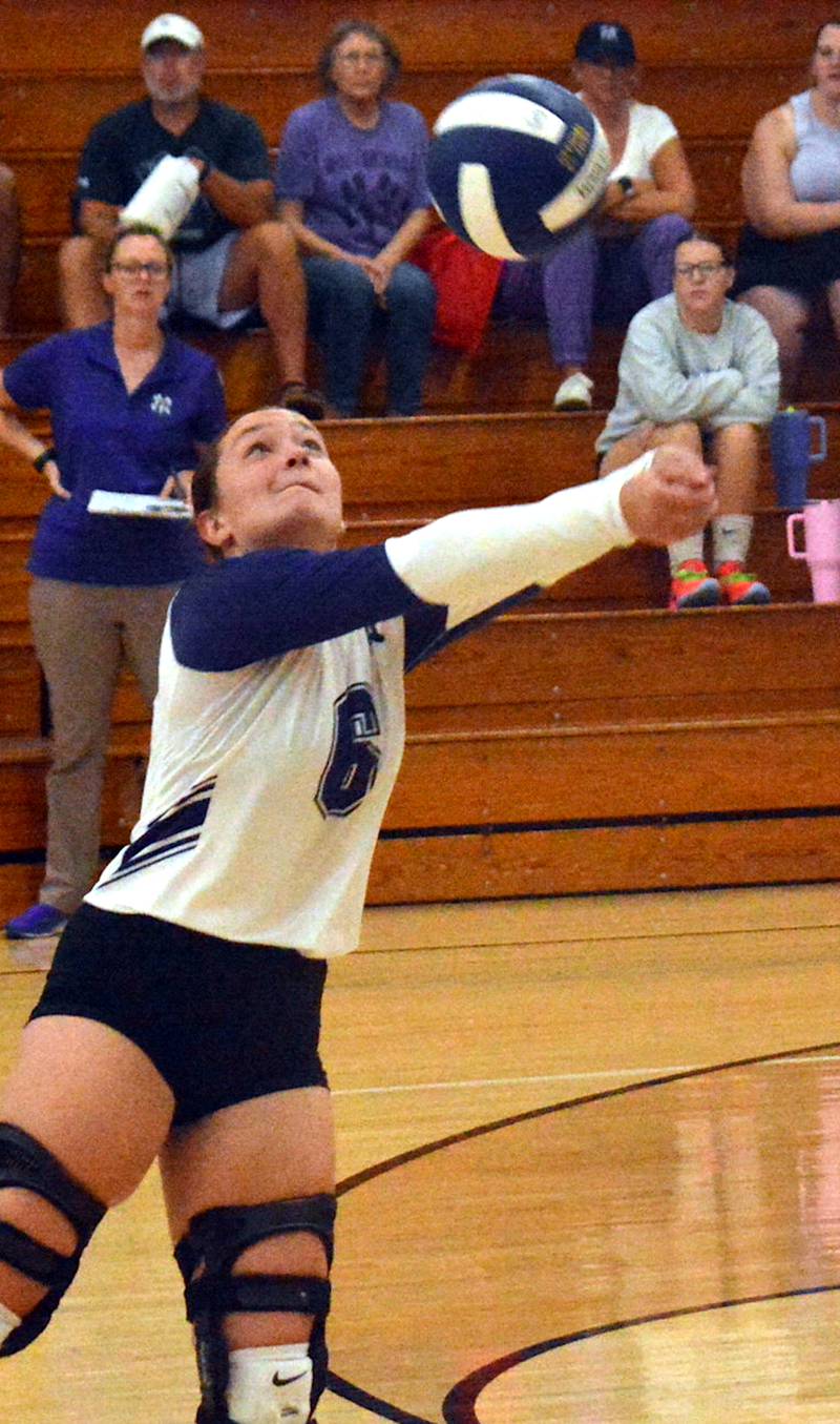 NV/OM senior Caroline Britten passes the ball to a teammate in the Wolverines' 2-0 win Sept. 9 at home against Wayne.