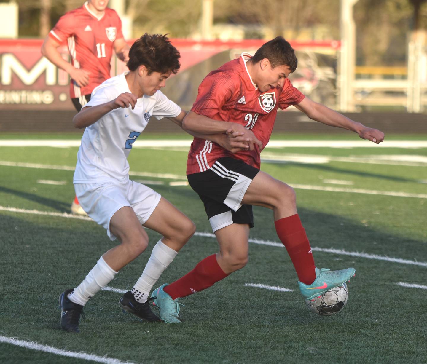 Sophomore Hector Sauzo steals the ball from Lewis Central Titan Daniel Overall during the 10-0 loss April 23.