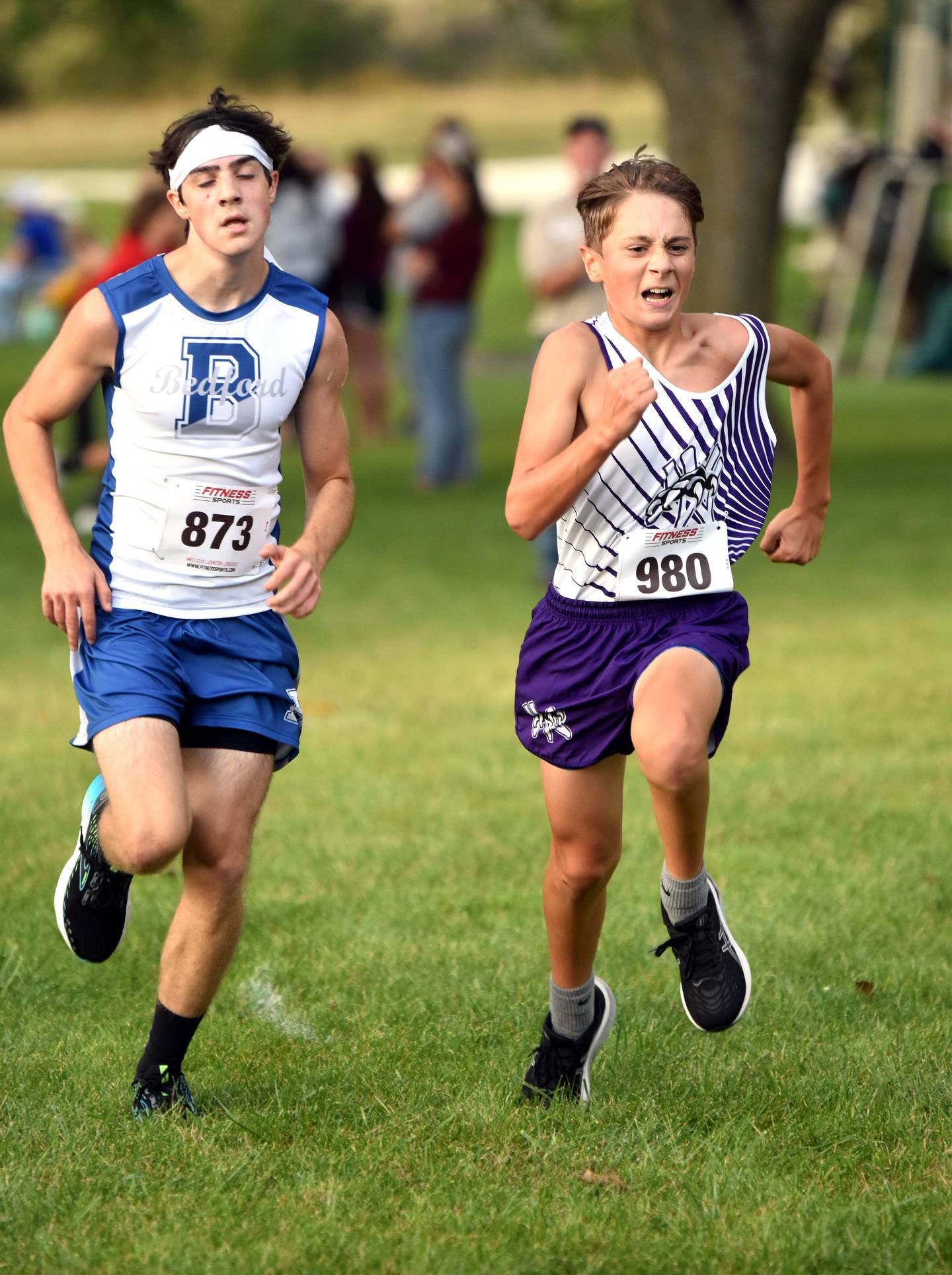 Sam Miller of Nodaway Valley out sprints Jayven Welch of Bedford to take 26th place in 22:34.26.