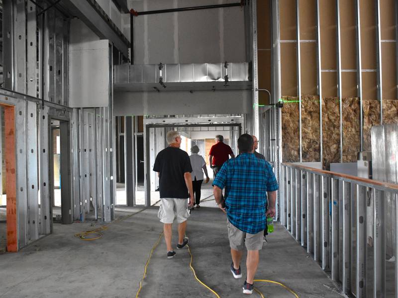 Members of the Creston School Board walk through construction on the new Early Childhood Center.