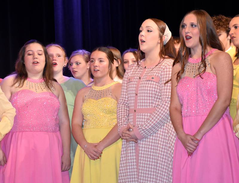 Members of the "Catch Me If You Can" ensemble sing during a rehearsal. Front row, left to right: Trinite Smith, Lilly James, Rhianna Weems, Emma Bolton.