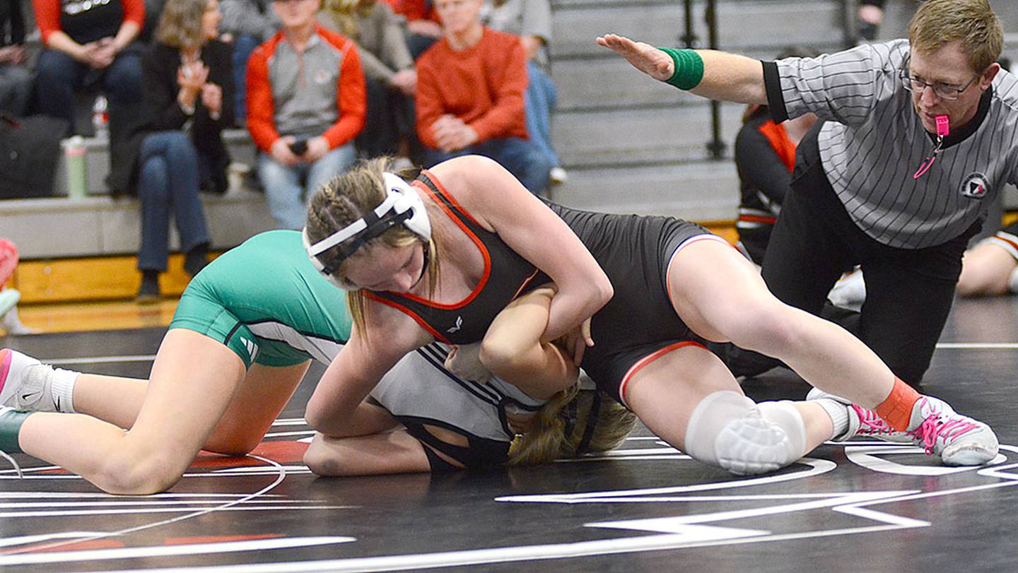 Creston Karter Clayton starts to earn nearfall points during a victory over Jacey Stafford of Southeast Warren. Clayton placed third and was one of four seniors in the program honored before the tournament.