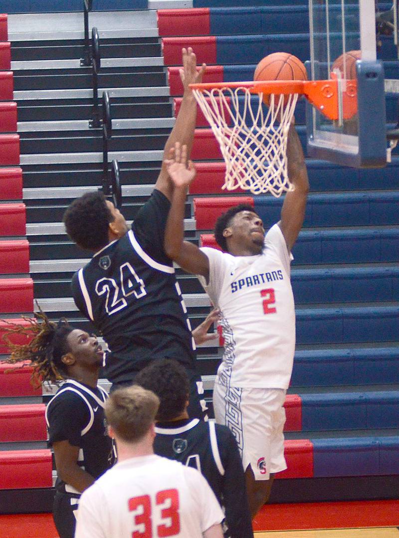 Southwestern freshman Rickey Loftin II of Omaha scores a lay-up against DMACC's Jamal Ambrose during Saturday's conference opener. Loftin finished with four points.