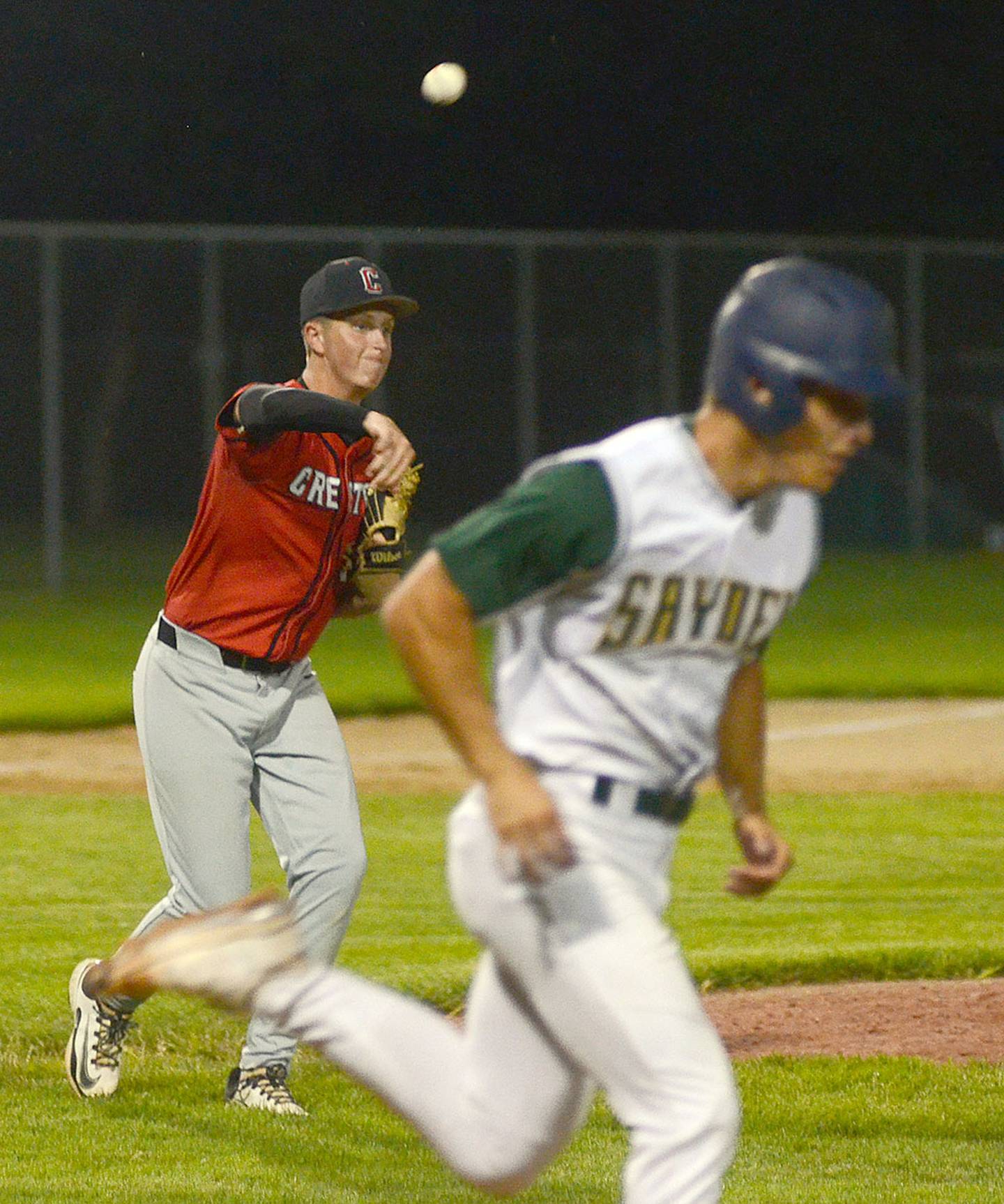 Rhett Driskell throws to first base after fielding a bunt against Saydel. Driskell started at second base and pitched 1 1/3 innings of relief.