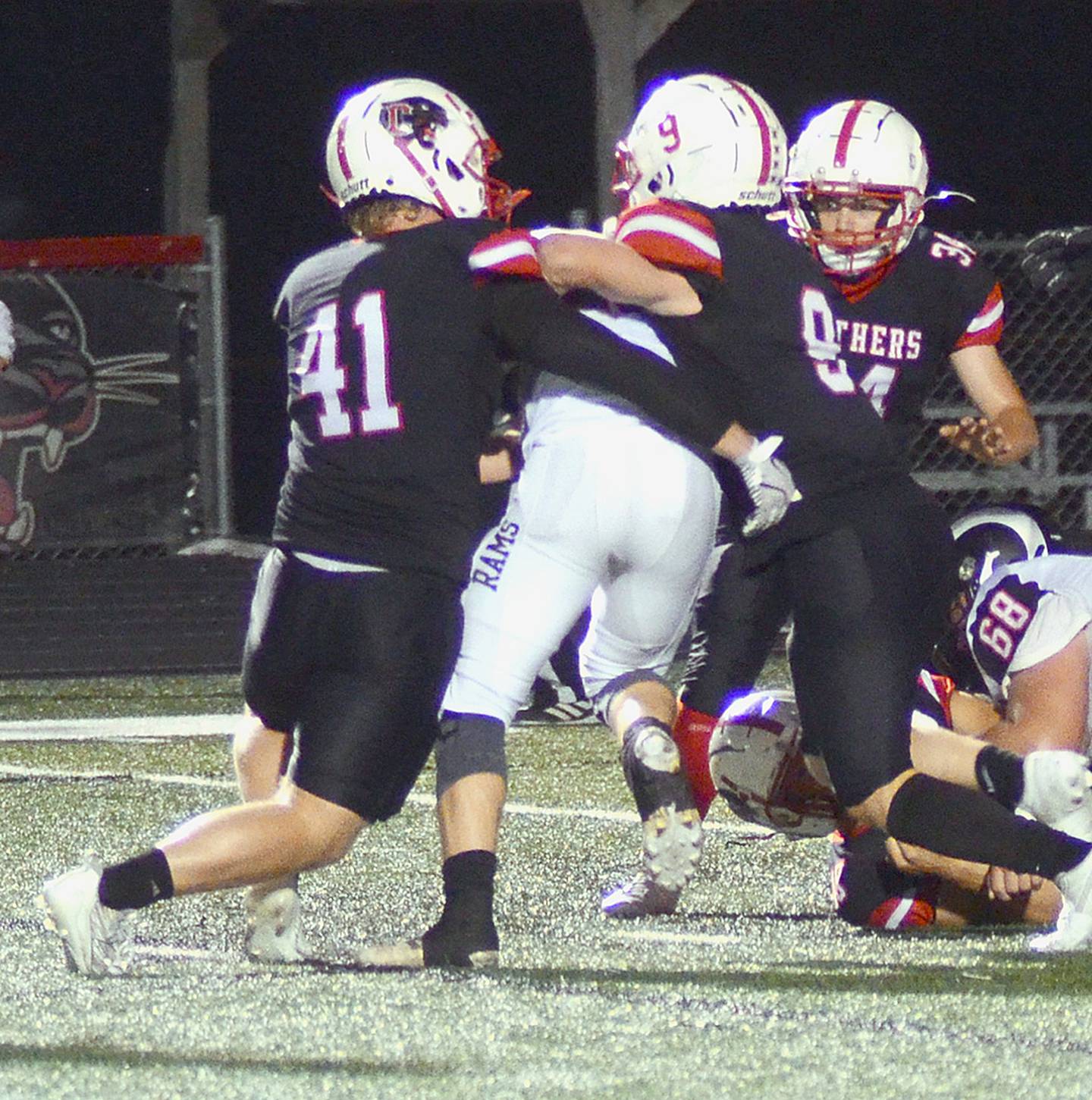 Creston's Tom Mikkelsen (41), Brodrick Phelps (9) and Colby Brammer (34) converge on Greene County quarterback Zack Stalder. Mikkelsen had a team-high 5.5 tackles, including four solo stops.