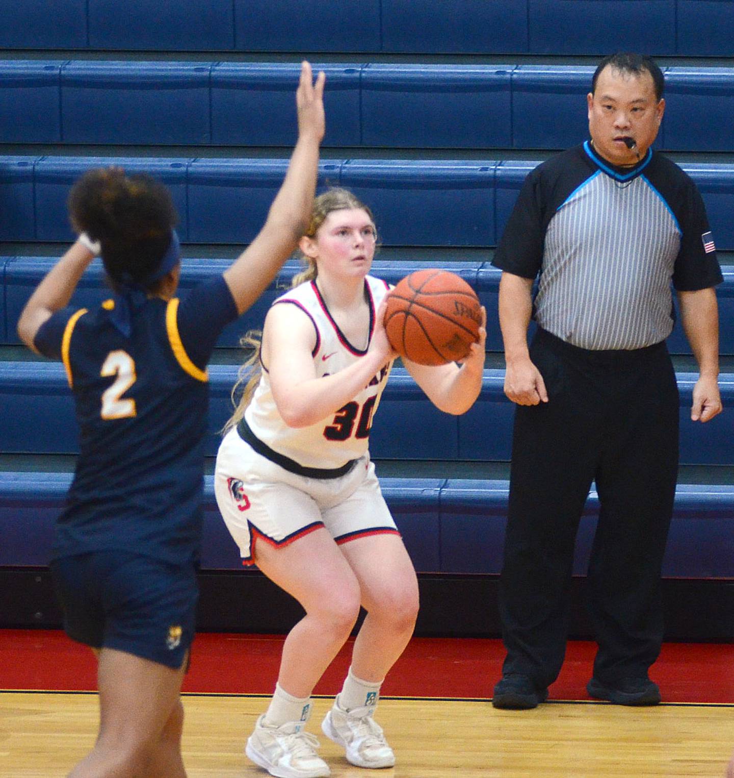 Maddie Richter of Southwestern sets for a 3-point shot against Marshalltown. Richter made one 3-pointer in scoring seven points for the Spartans.