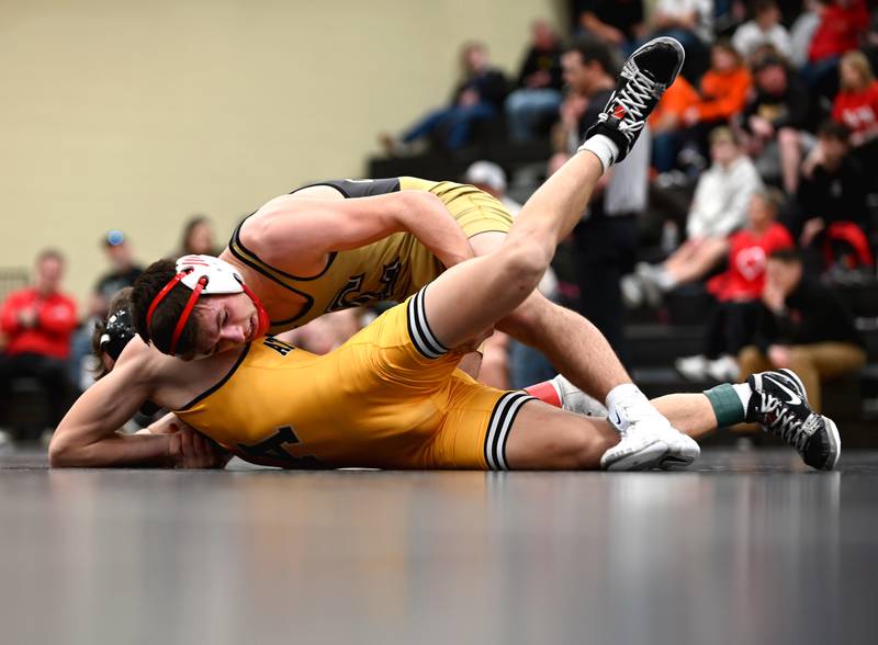 Lane Travis controls Landon Hagan of Atlantic in the 138-pound finals.