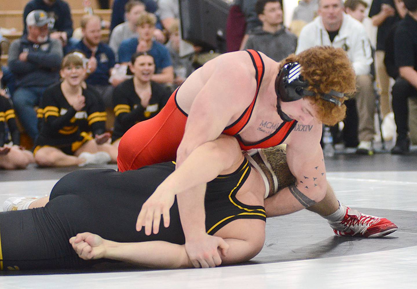 Creston's Weston Trapp (top) works for nearfall points against Bowen Tradlock of Winterset in their consolation semifinal match. Trapp won by a technical fall on the way to placing third for the Panthers.