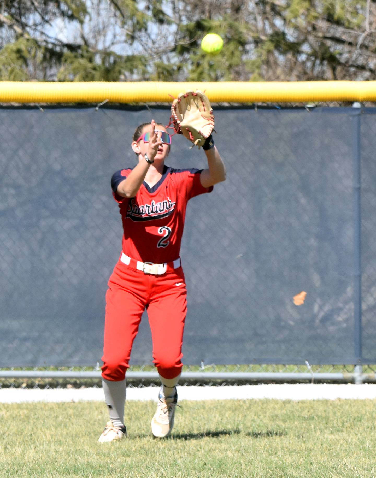 Freshman right fielder Jersey Gray makes a snag in the outfield Friday in game one against the Reivers.