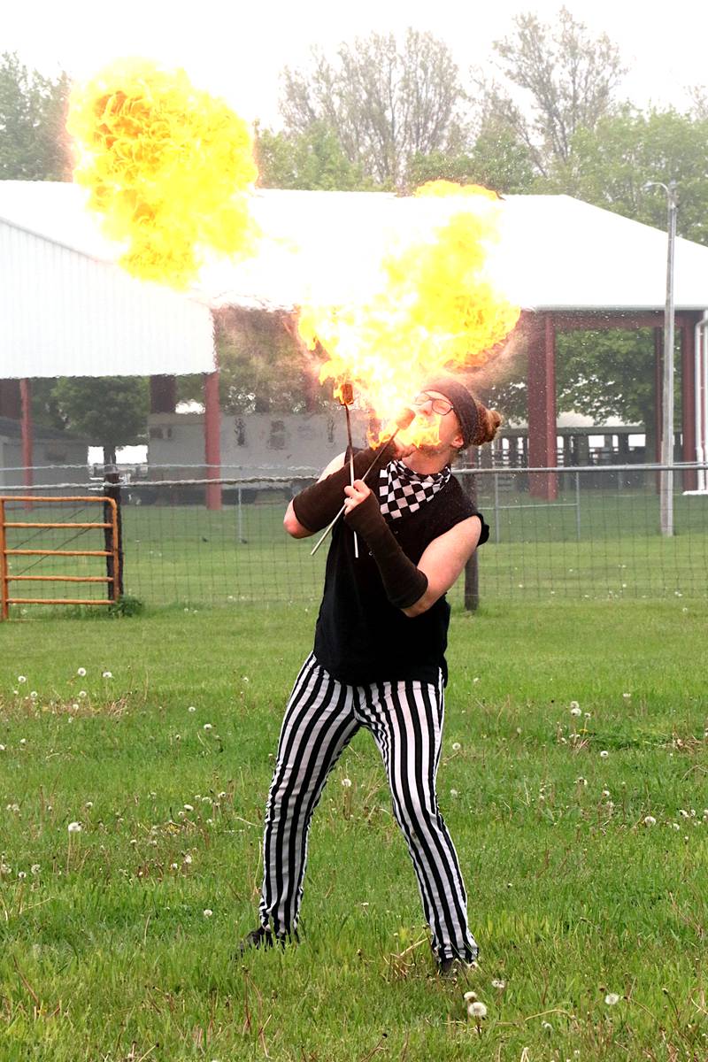 A fire breather entertains faire-goers at a renaissance faire held last year in Greenfield. The event makes its return this weekend at the Adair County Fairgrounds.