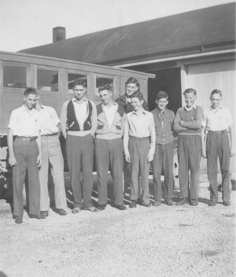 Believed to be riders of the school bus from the Kent area to Cromwell in 1940, taken by bus driver LeRoy Reeve, pictured left to right, Darrel Stevens, Paul Bailey (face hidden), Donald Clem, Willie McFee, Leo (John) McManus, Hans Larson, Carl Thompson and Dick Murphy; in back is Jack Stevens.