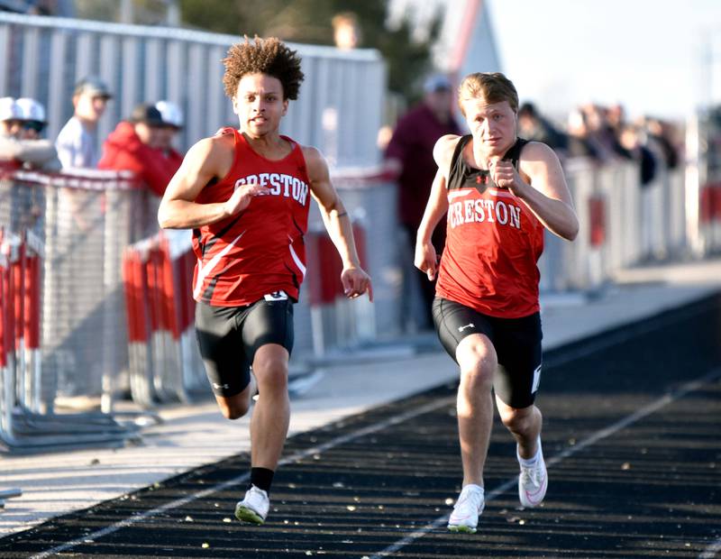 Creston’s Xander Drake and Austin Evans race side-by-side in the boys 100m dash Monday at the Creston Coed. Both athletes competed on winning relays.