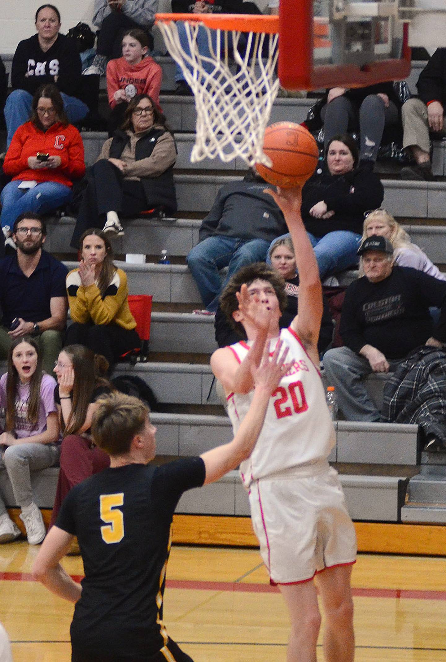 Creston's Jaxson Jondle (20) scores a layup against Atlantic. Jondle scored 11 points in the 63-58 win.