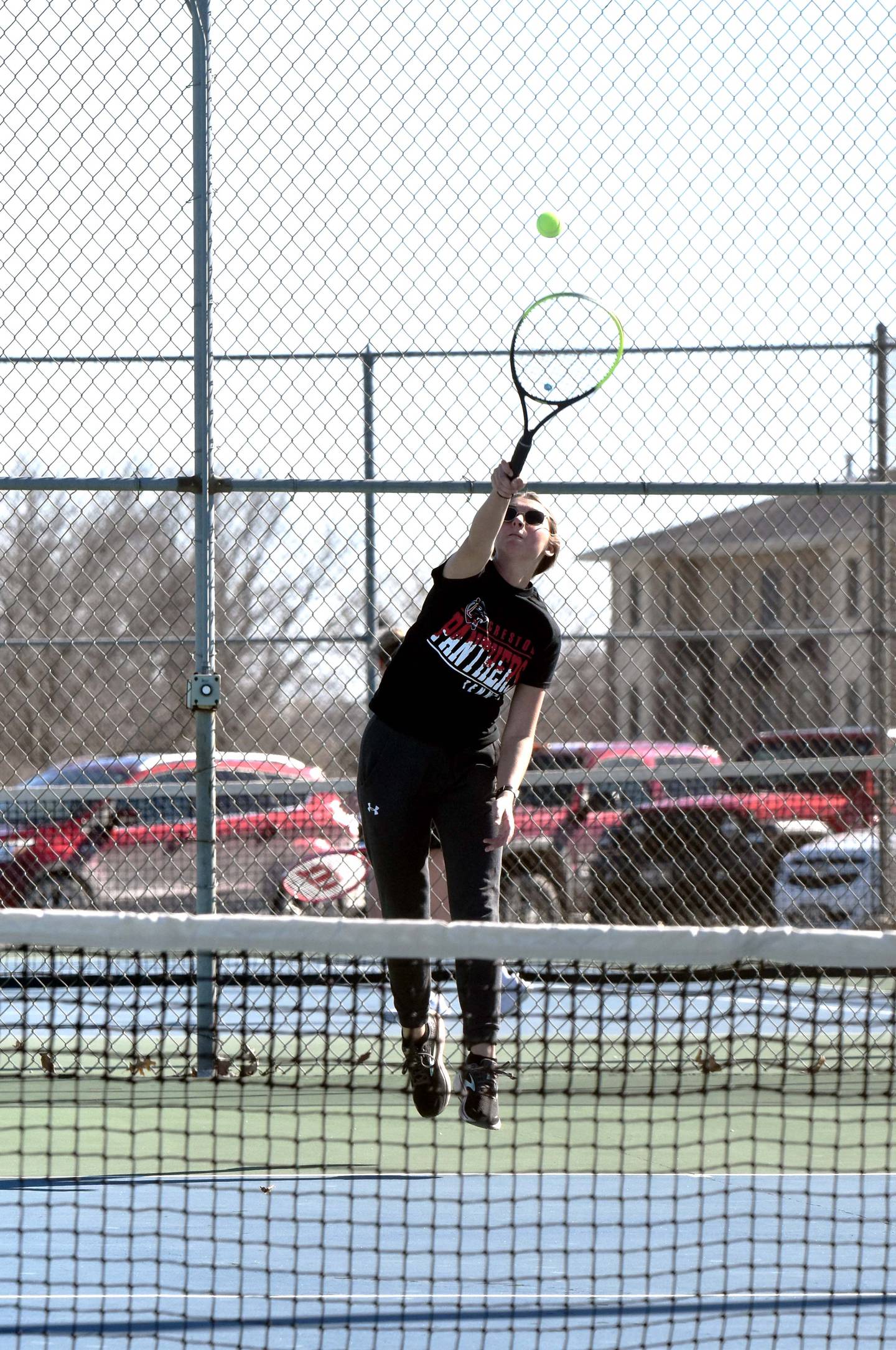 Kolbey Bailey serves to Lily Willrich of Atlantic in her 8-5 No. 4 singles win.