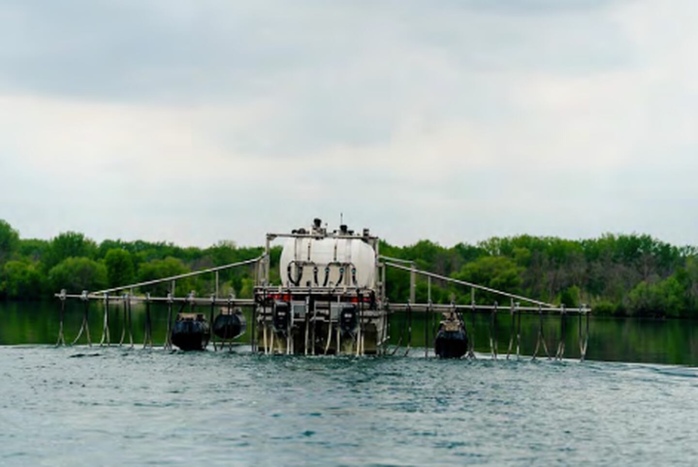 An application barge applies alum at Prairie Rose Lake in Harlan.