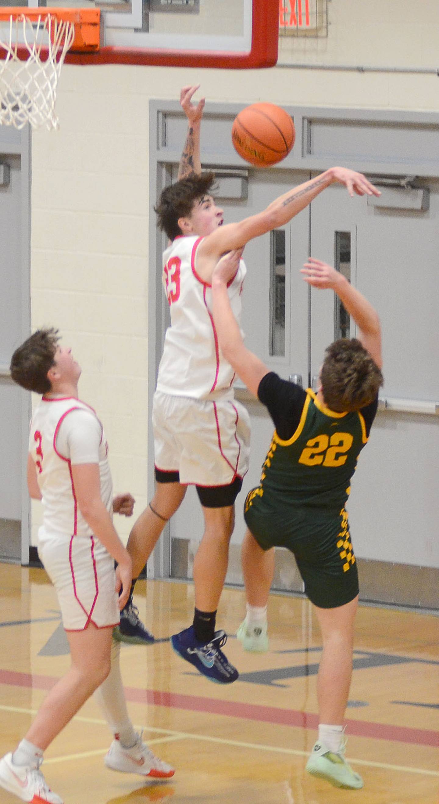 Creston's Parker Varner slices through St. Albert defenders for a reverse layup in the second half of Tuesday's 59-56 loss to the Falcons. Varner scored a team-high 16 points.