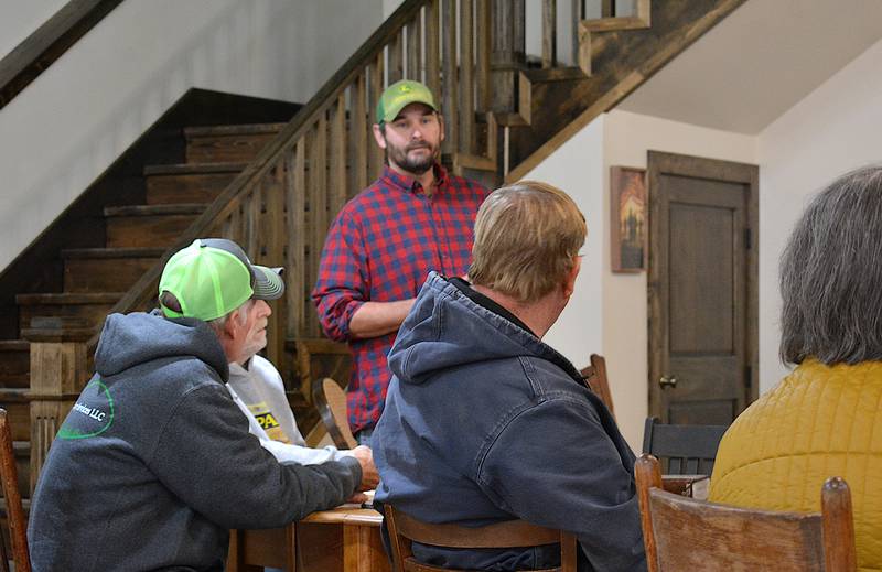 Mayor Waylon Clayton listens to Creston residents during his coffee meeting Saturday.