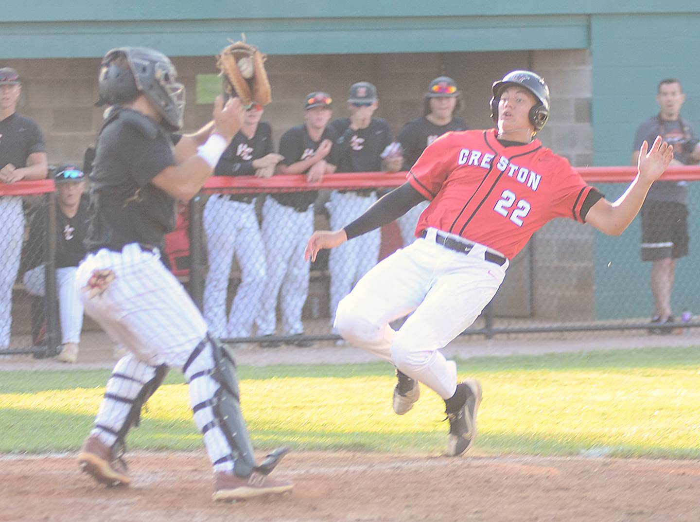 Harlan catcher Hayden Soma receives a throw from the outfield after Tanner Ray's single in the second inning Monday. Creston's Braydon Schoon (22), a courtesy runner for pitcher Parker Varner, was out attempting to score on the play.