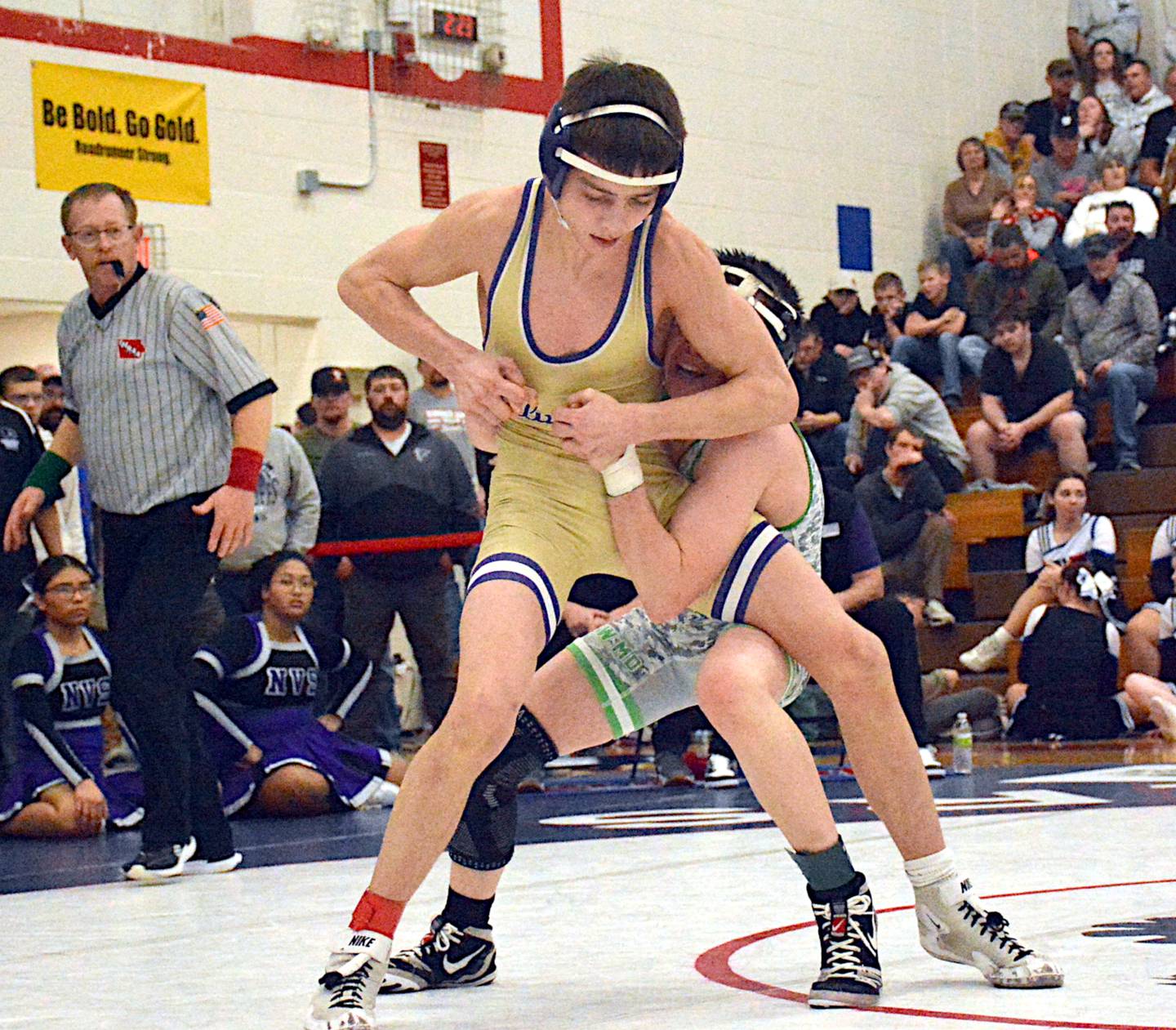 Wolverine sophomore Josh Nelson escapes Hudson Cox of Southeast Warren in their 106-pound finals match at districts.