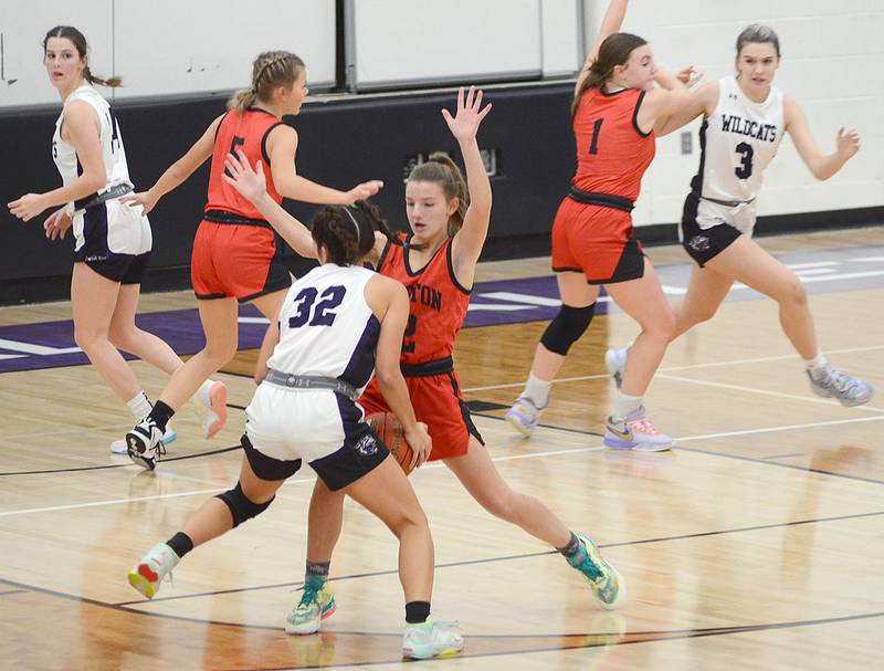Creston senior Lydia Goins defends West Central Valley's Malia Fuller (32) while teammates Ava Adamson (5) and Hollynn Rieck cover other Wildcats during Tuesday's game. Creston's defense allowed only 21 points in the second half of the 51-46 victory.