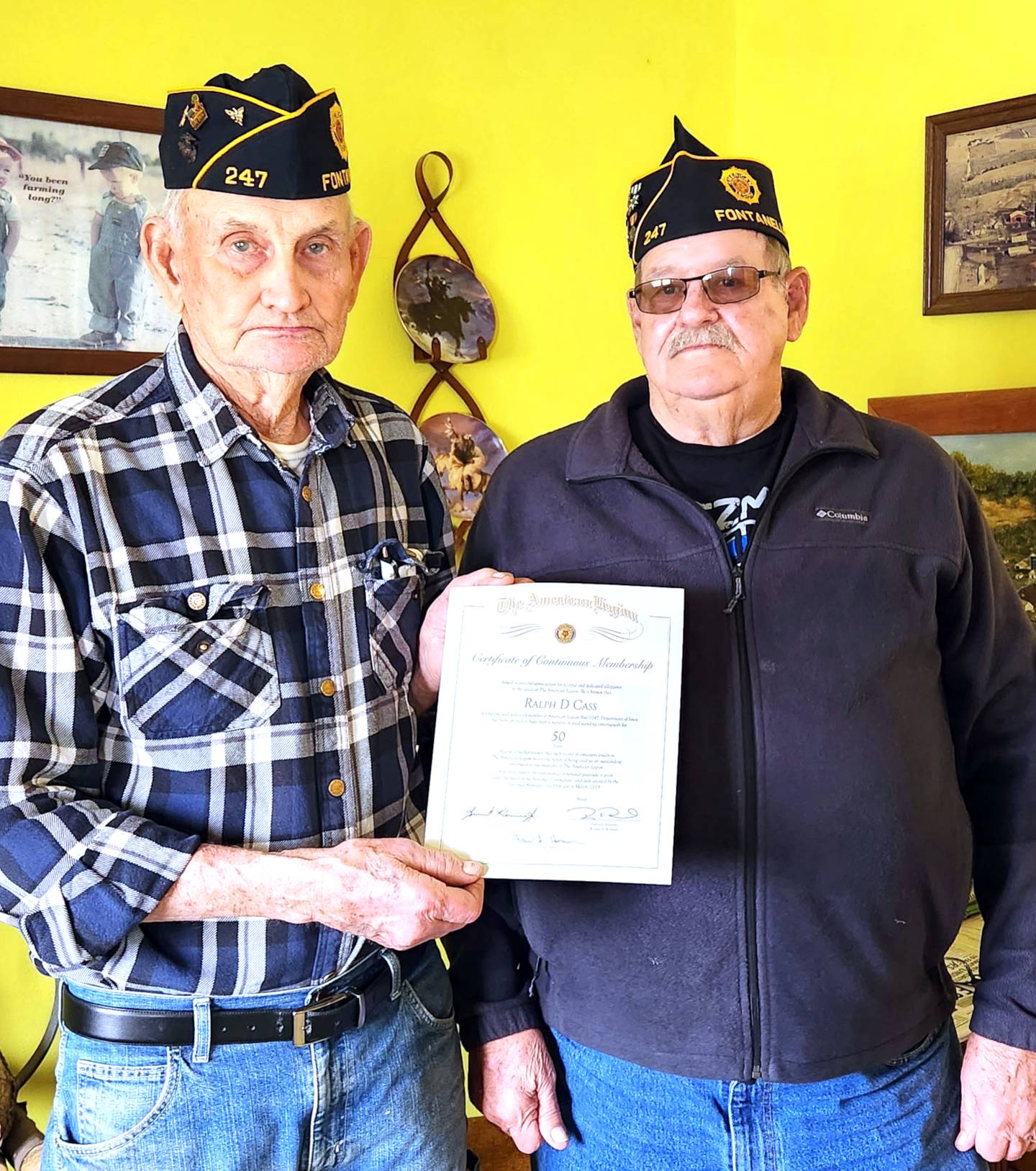 Dean Cass of Fontanelle receives a certificate celebrating his 50 years as a member of the Carlson American Legion Post 247 of Fontanelle from Post Treasurer Dave Homan.