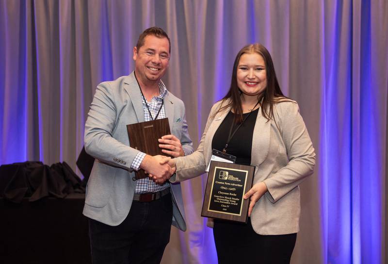 CNA Senior Editor Cheyenne Roche is awarded the Genevieve Mauck Stofuer Outstanding Young Iowa Journalist Award by Iowa Newspaper Foundation President Chris Conetzkey on Feb. 6 at the annual Iowa Newspaper Awards in Des Moines.