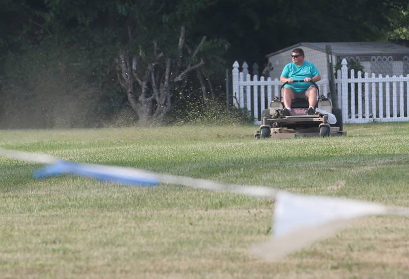 A volunteer mows grass Monday, Aug. 21, 2023, at the Bureau County Fairgrounds in Princeton. The 168th Bureau County Fair begins Wednesday and concludes on Sunday in Princeton.