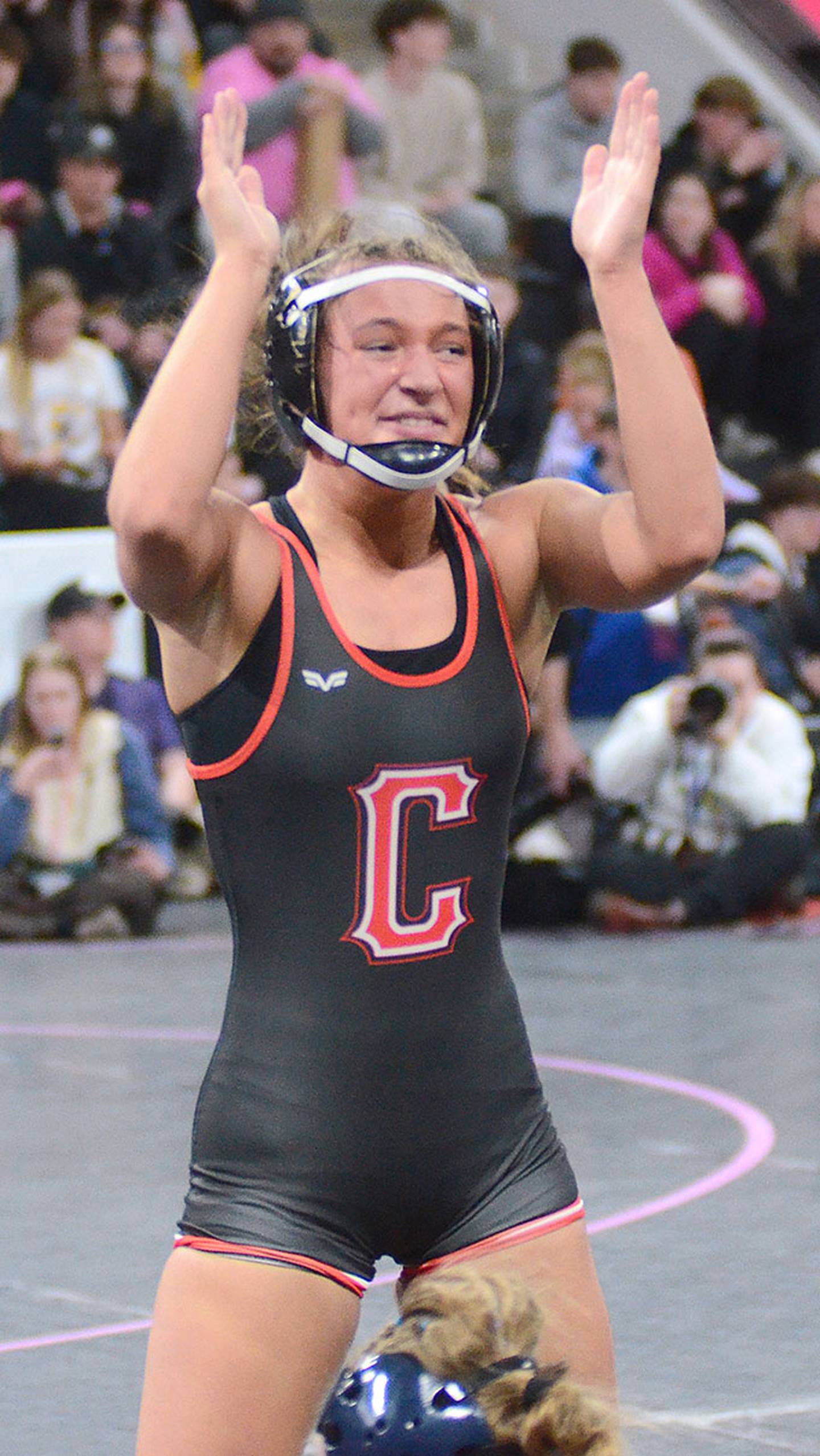 Creston's Alainah Galanakis celebrates her first-round victory over Perry's Cate Erickson.