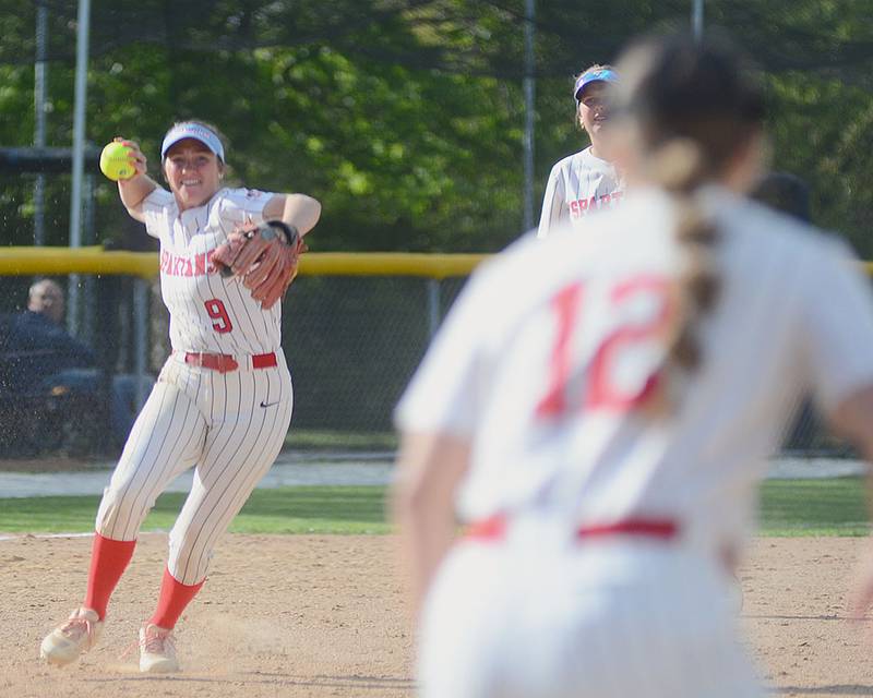 Southwestern shortstop Emma Moore throws to first baseman Hannah Hackmann after fielding a ground ball against Iowa Western Wednesday.
