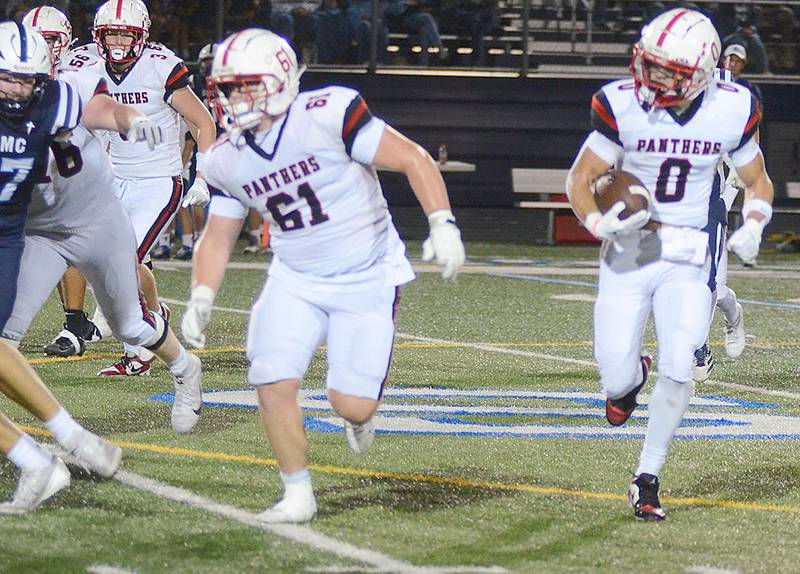 Creston's Seth Gordon (0) follows the blocking of Garrick Clausen (61) after receiving a shovel pass. Gordon caught six passes for 120 yards in the loss at Des Moines Christian.