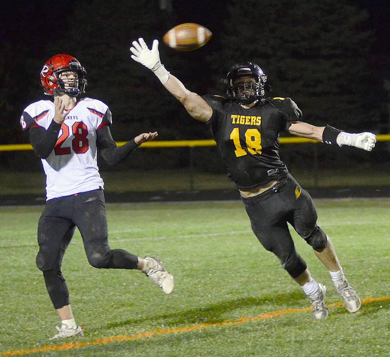 Jordan Martin-England of Lenox (18) bats down a fourth-and-goal pass intended for Ar-We-Va running back Wade Ragaller in the fourth quarter of Friday's playoff win.