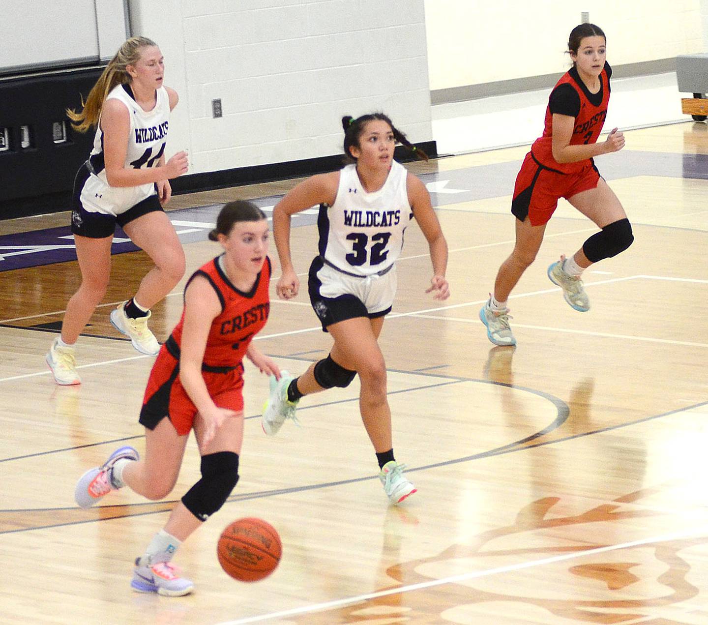 Hollynn Rieck leads a Creston fast break against West Central Valley Tuesday, flanked by teammate Braylee Pokorny (right). Rieck dished out six assists while scoring 10 points in the 51-46 win.