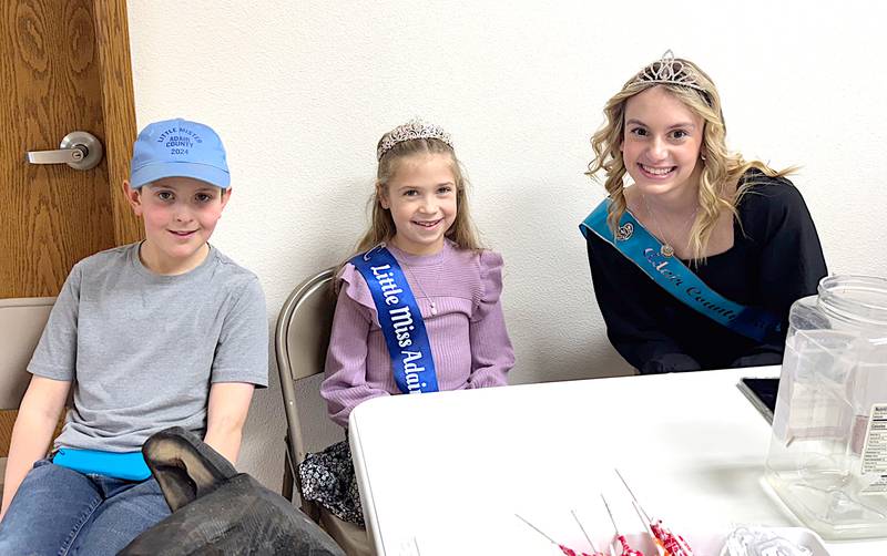 From left, Little Mister Adair County Benjamin Moyer, Little Miss Alexis Dreyer and Fair Queen Bailey Carstens during the fair board's soup and sandwich luncheon.