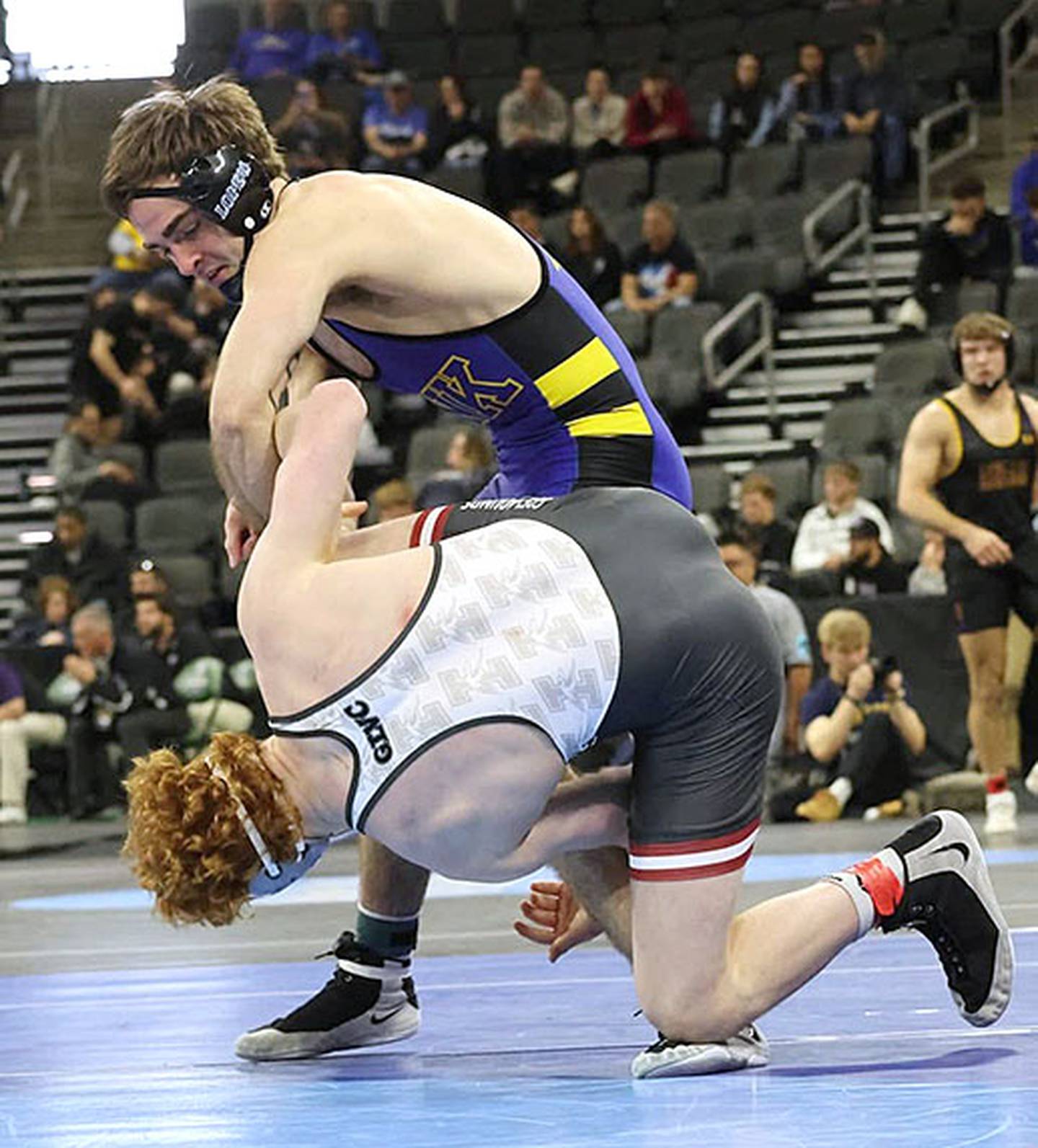 UNK's Jackson Kinsella scrambles for position against Ethan Farnell of Indianapolis on his way to a 12-4 major decision victory in the opening round of the national tournament.