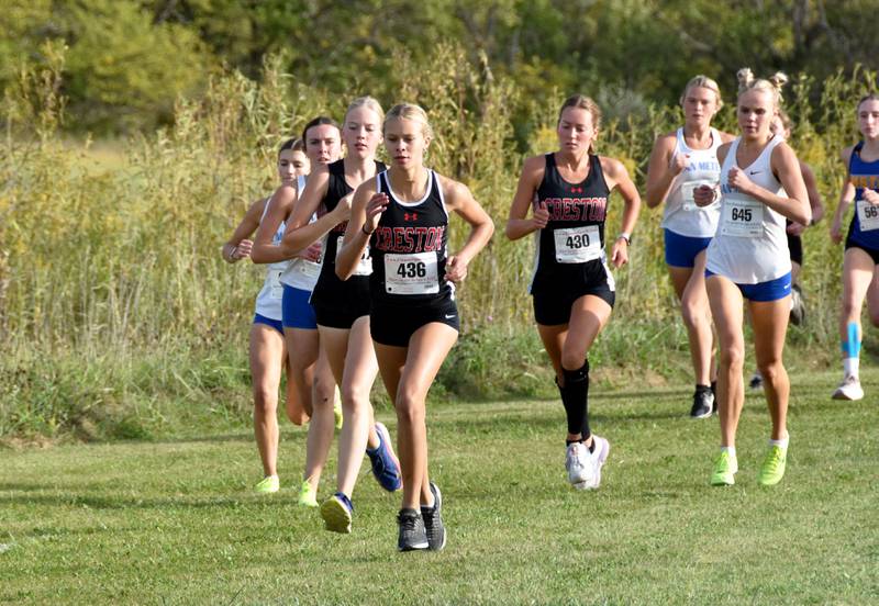 From left, sophomore Reese Strunk, freshman Cora Smith and senior Payton Davis run as a Panther pack at the start of the Clarke Invitational Tuesday. Smith placed eighth, Davis ninth and Strunk 10th. The girls took third as a team.